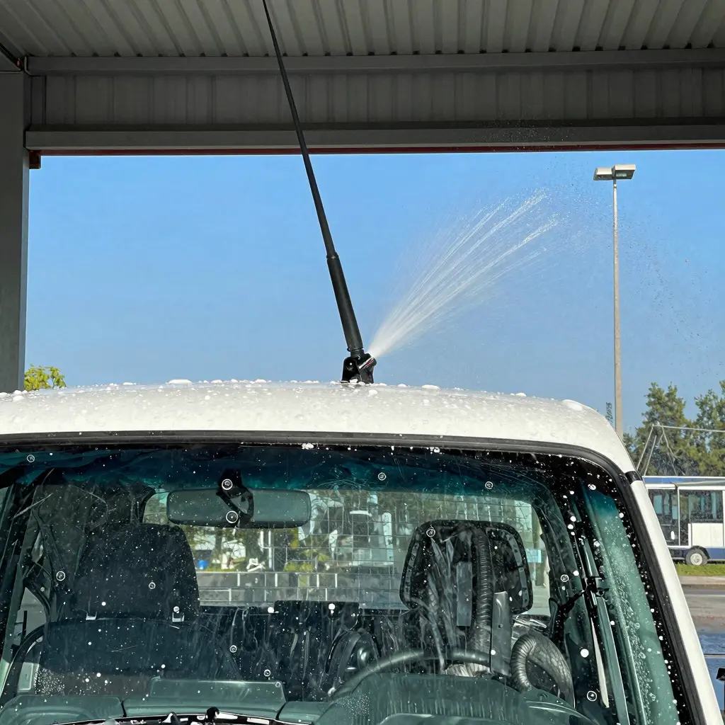 Truck with a raised antenna in a car wash